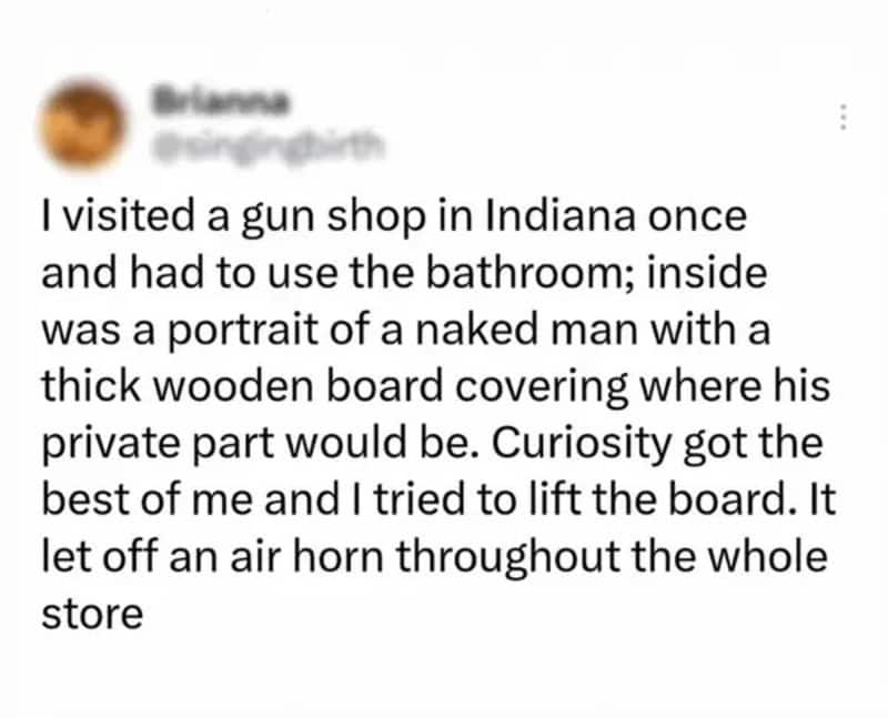 A woman shares a funny story about a gun shop bathroom incident with a wooden board covering a man's.