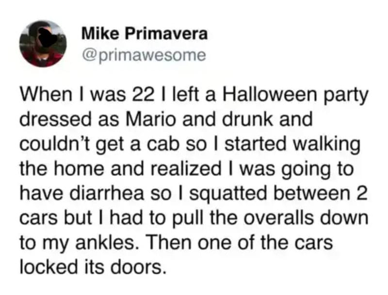 A person dressed as Mario walking home after a Halloween party, squatting between cars.