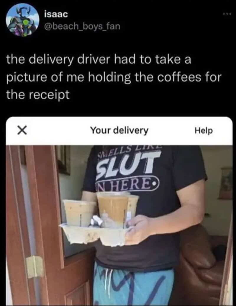 Delivery driver holding coffees for the recipient, wearing a shirt that says 'Smells Like Slut'.