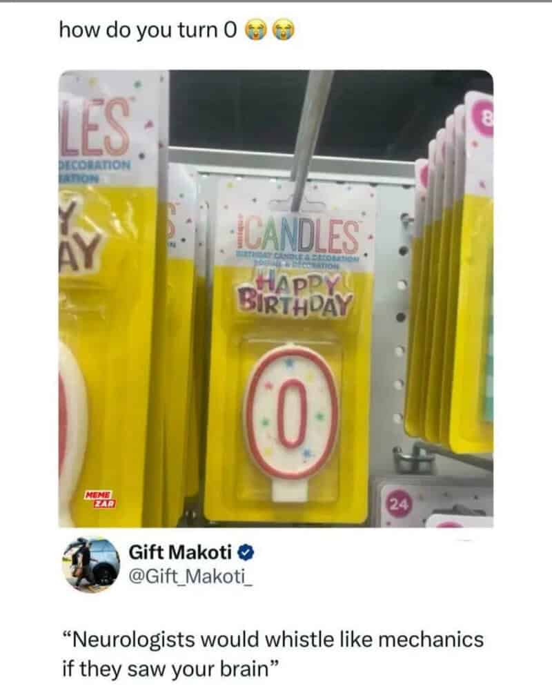Zero birthday candle on store shelf with colorful packaging.