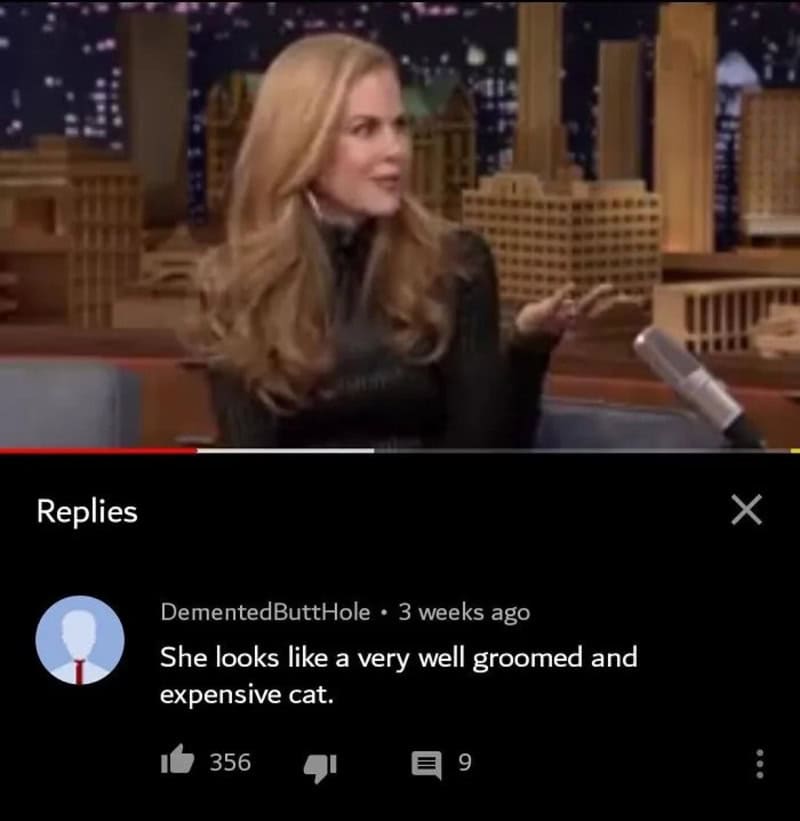 Woman with long blonde hair on talk show, gesturing with her hand.