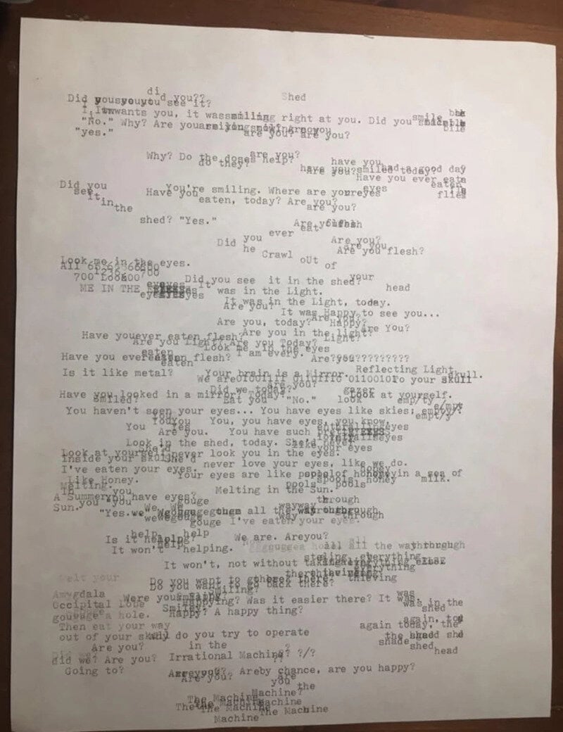A blurry, black-and-white image of a handwritten or typed text with many crossed-out words and edits.
