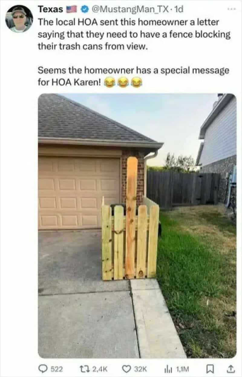 Fence blocking trash cans with a humorous message for HOA Karen.