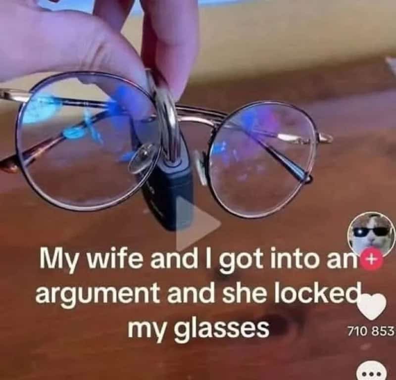 Glasses locked with a black clip, caption about wife locking glasses after argument.