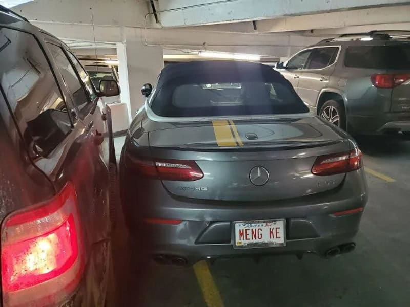 Mercedes-Benz SLK200 with custom license plate 'MENG KE' in parking lot.