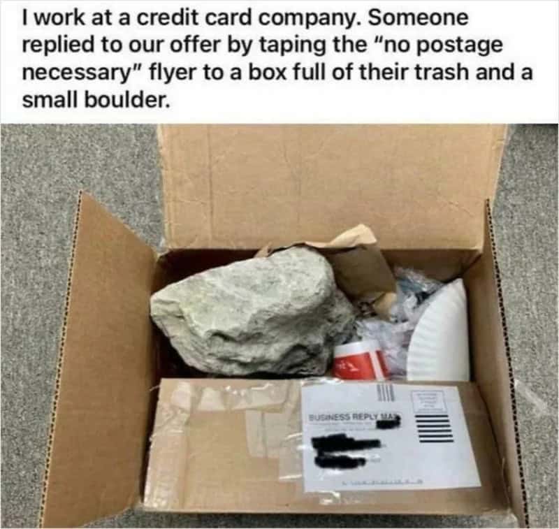 Box with trash, rock, and reply mail, with caption about no postage flyer.