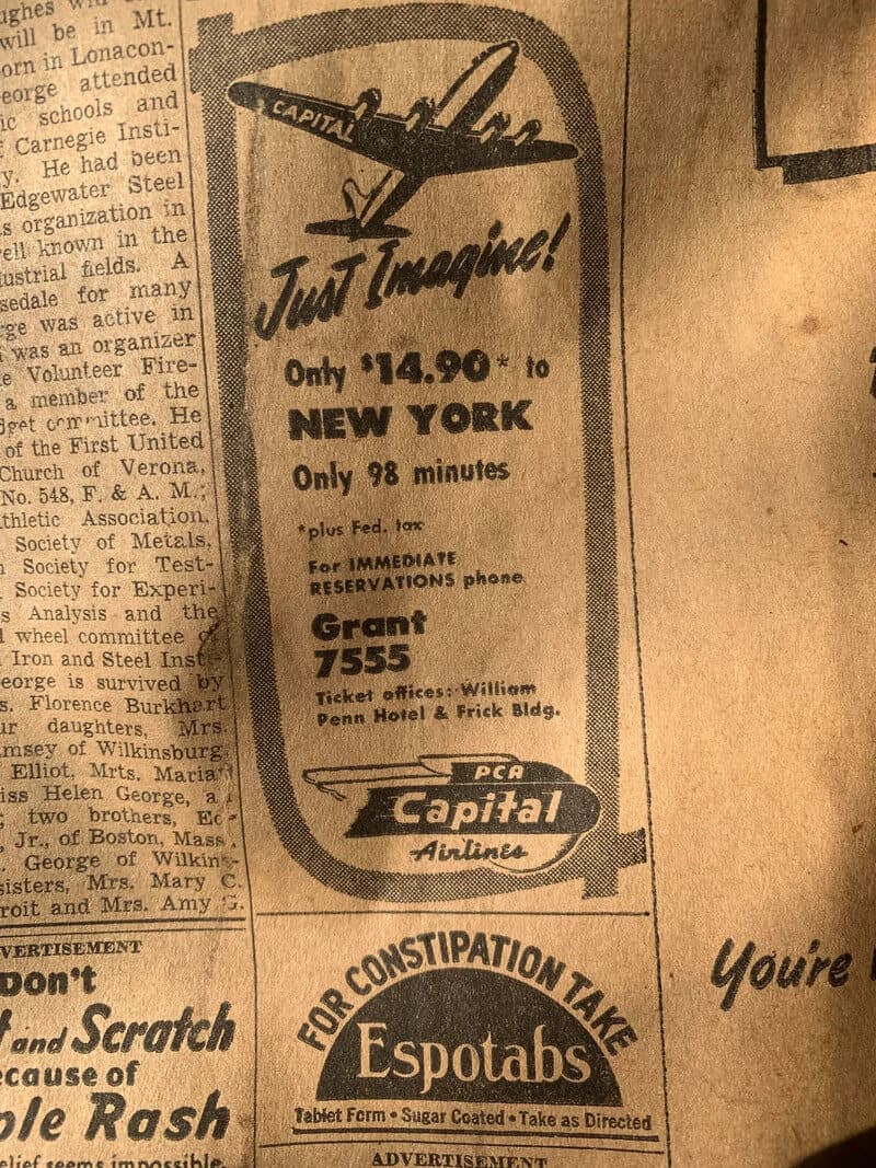 Advertisement for a flight to New York for $14.90, 98 minutes, with contact details.