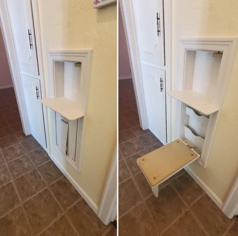 Vintage wall-mounted fold-down chair in a kitchen, painted white.