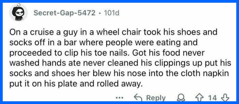 A man in a wheelchair removes shoes and socks on a cruise, touching his nose with his socked foot.