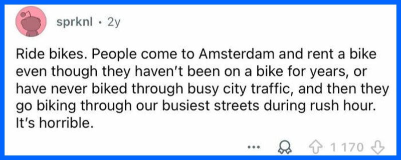 People riding bikes through busy Amsterdam streets during rush hour.