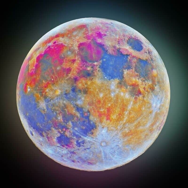 Colorful full moon with vibrant hues of pink, blue, and orange.