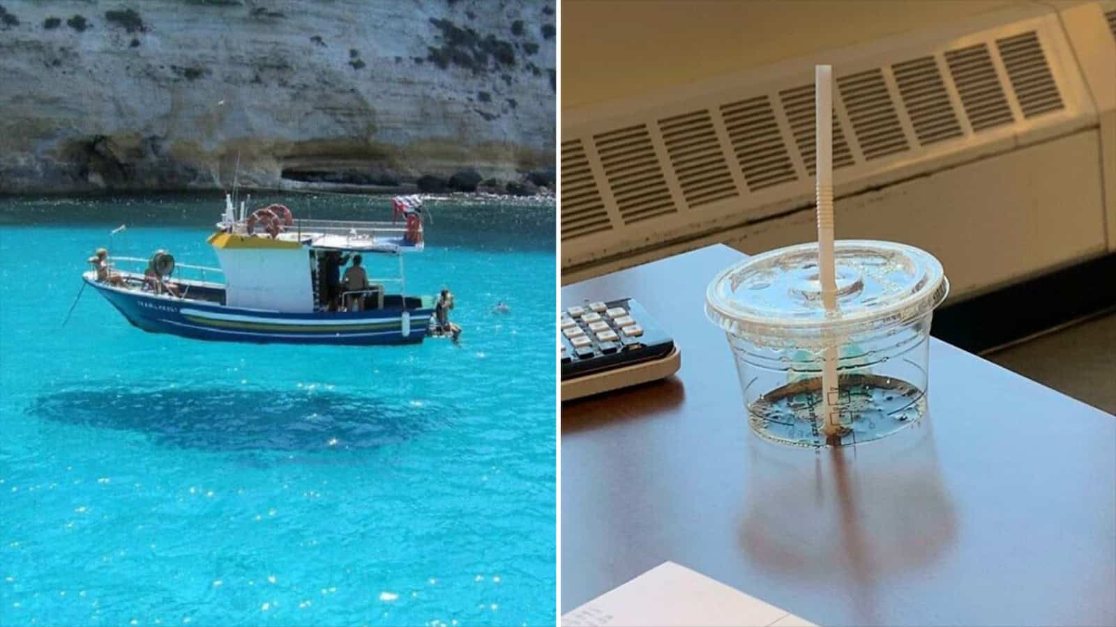 Boat floating in clear blue water with a rocky background.