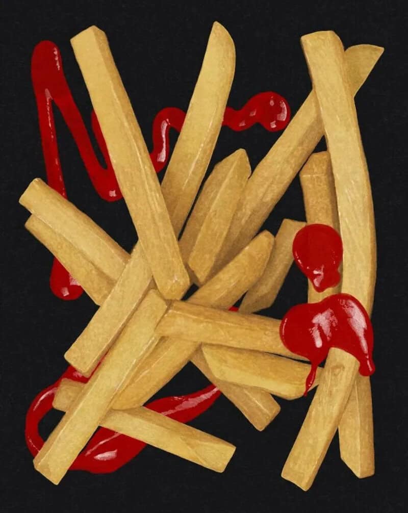 French fries with ketchup on a black background.