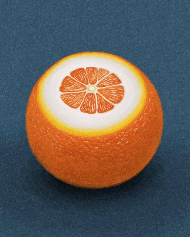 Orange with a citrus slice inside resembling a flower on a blue background.