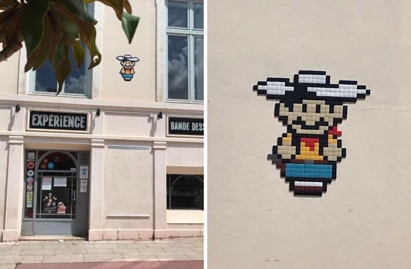 Pixel art of a character with a hat, glasses, and a red shirt on a white wall.