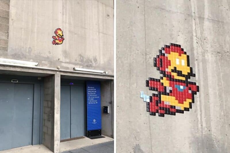 Pixel art of Mario and a small Mario figure on a concrete wall.
