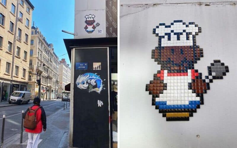 Street art mosaic of a pixelated chef with a spoon, part of street art mosaic in the Woup.