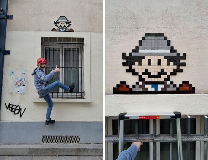 Person in gray hoodie and red helmet jumping near street art mosaic of a character.