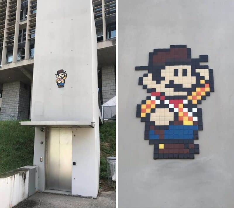Pixel art of Mario from Super Mario Bros. on a building wall.