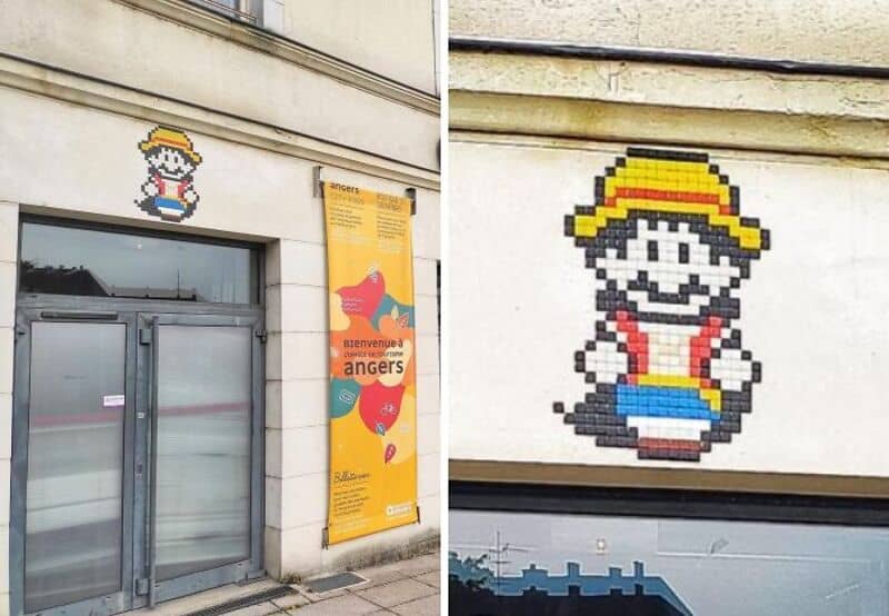 Pixel art of a girl with a yellow hat and red dress on a wall.