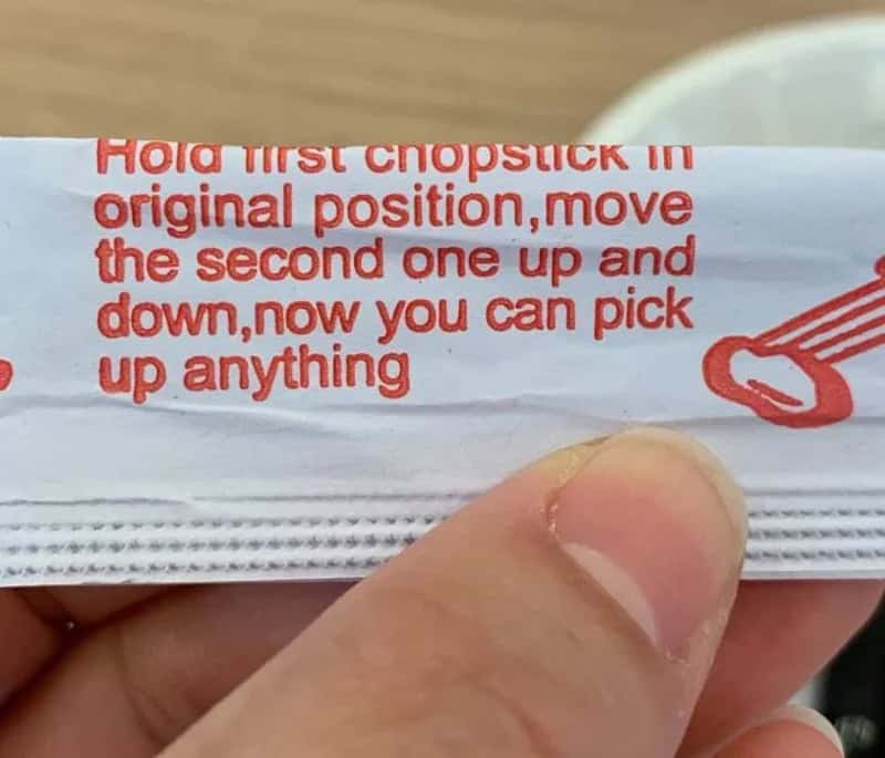 Hold first chopstick in original position, move the second one up and down.