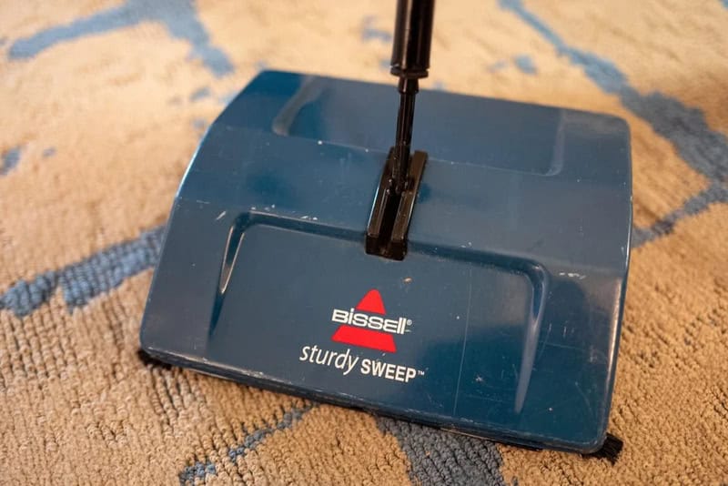 Bissell sturdy SWEEP vacuum cleaner on a carpet.
