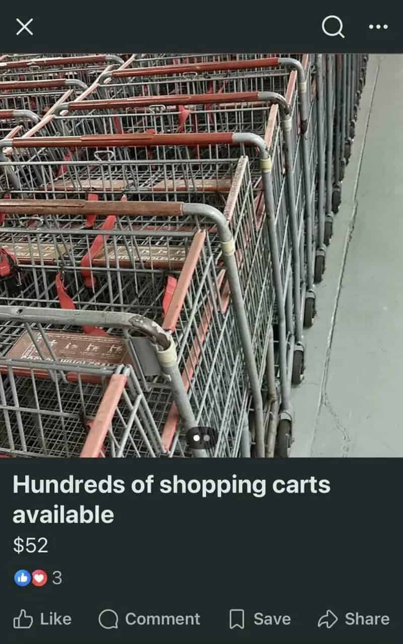 Multiple shopping carts lined up in a store aisle.