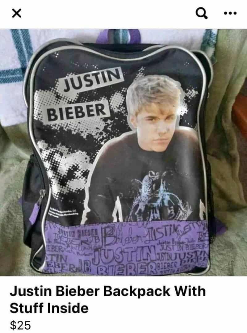 Justin Bieber backpack with black and purple design and image of Justin Bieber.