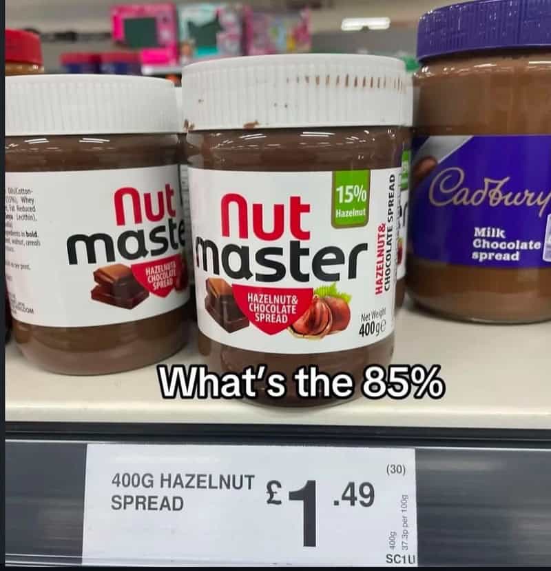 Nutmaster hazelnut chocolate spread jars on store shelf with price tag.