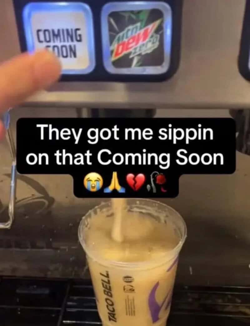 Person pouring a drink at a soda vending machine with a 'Coming Soon' sign and Mountain Dew logo.