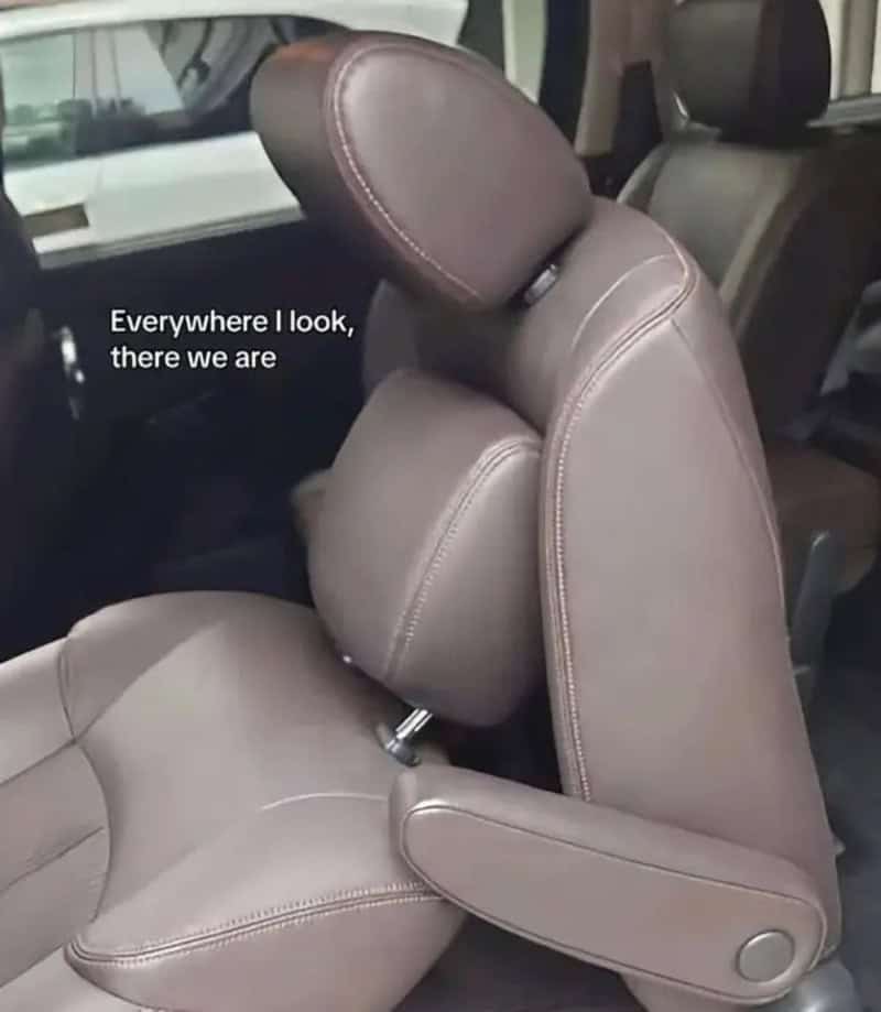 Car seat with headrest and text: 'Everywhere I look, there we are'.