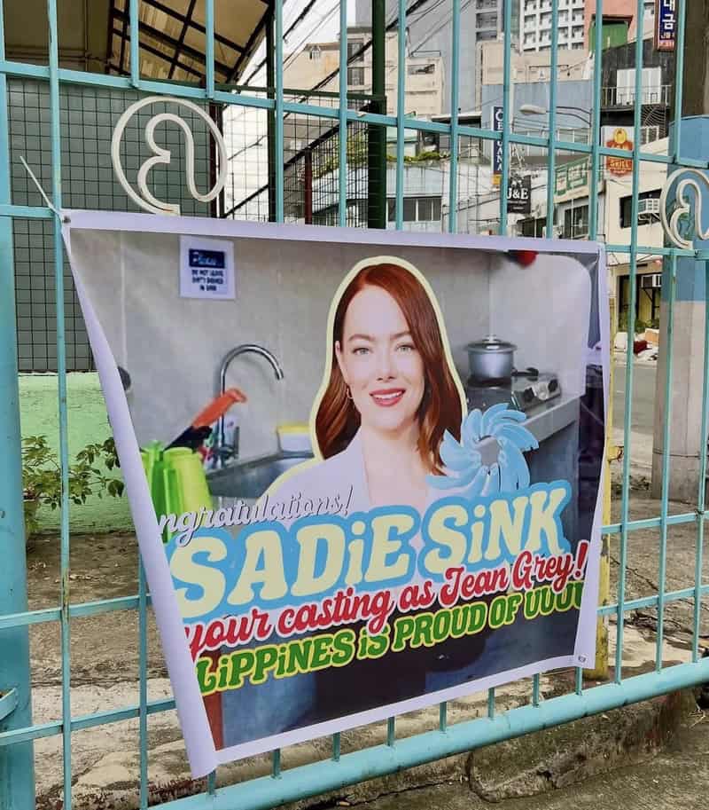Sadie Sink casting as Jean Grey banner in the Philippines, with a woman winking in the background.