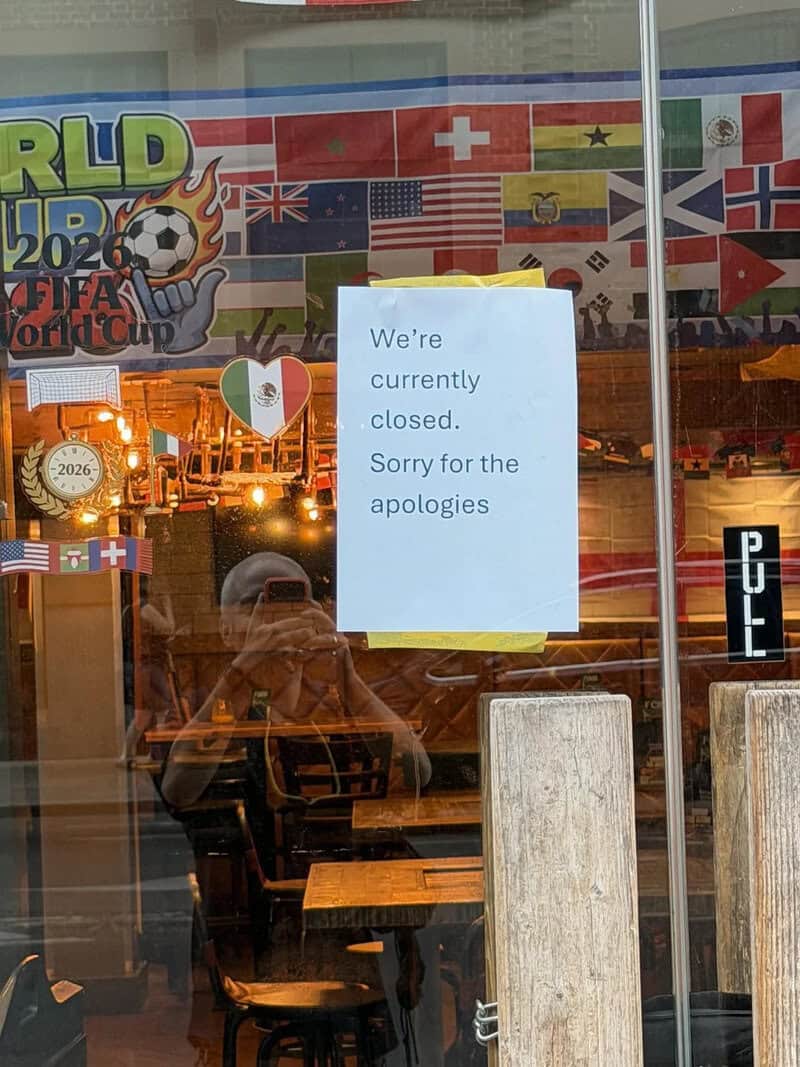 Closed restaurant with a sign saying we're currently closed, sorry for the apologies.