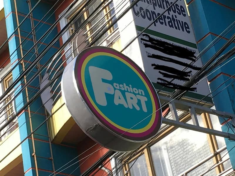 Fashion FART store sign with colorful border and blue background.