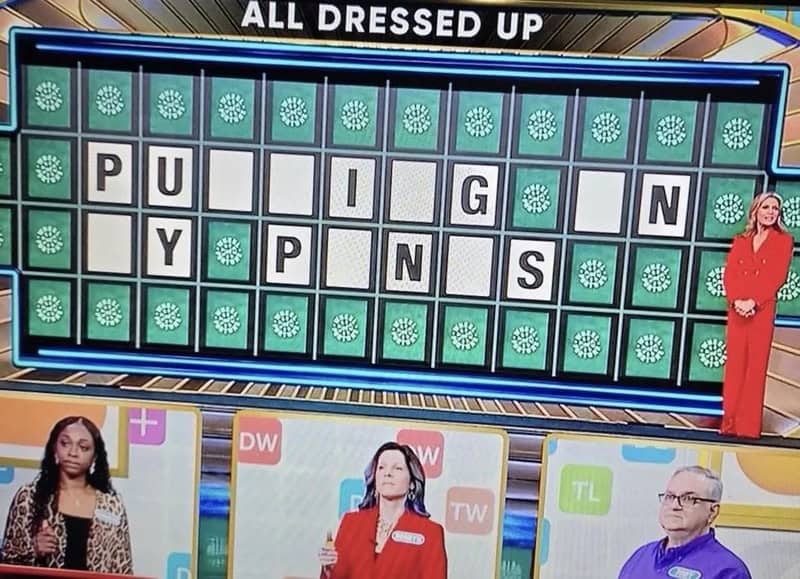 All dressed up puzzle with a woman in red and three hosts below.