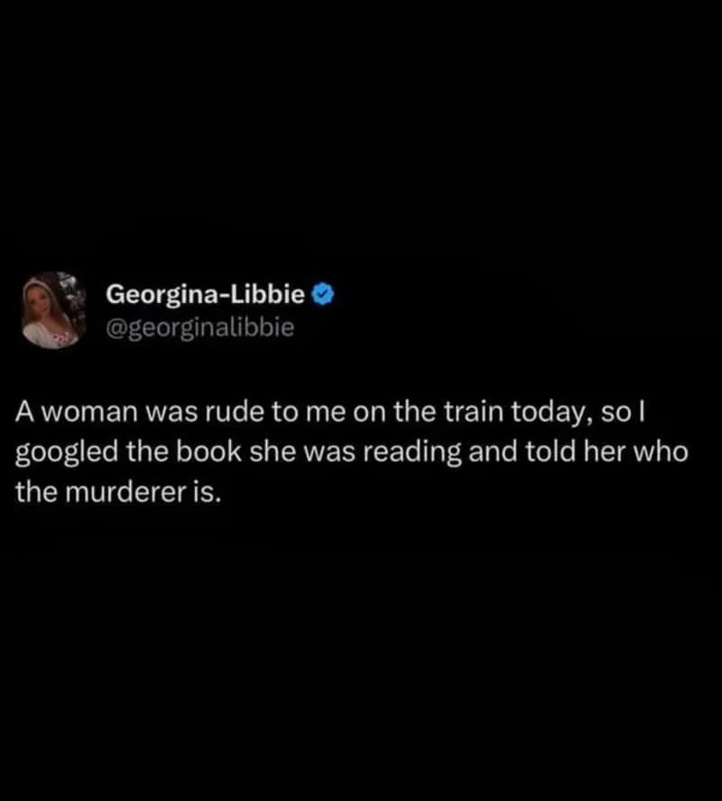 Woman on train reading a book, told by another woman who was rude to her.