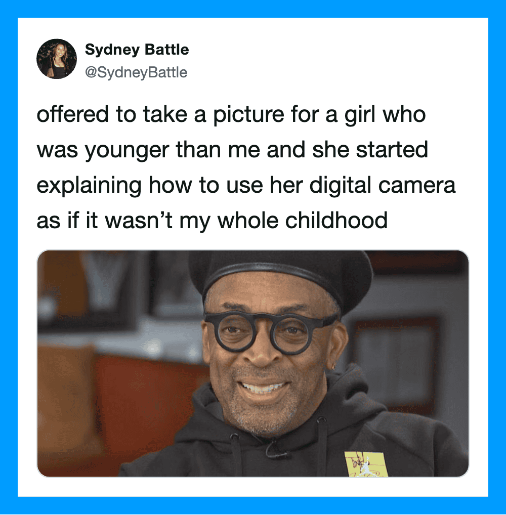A man with glasses and a black beanie smiling in a photo from a tweet.