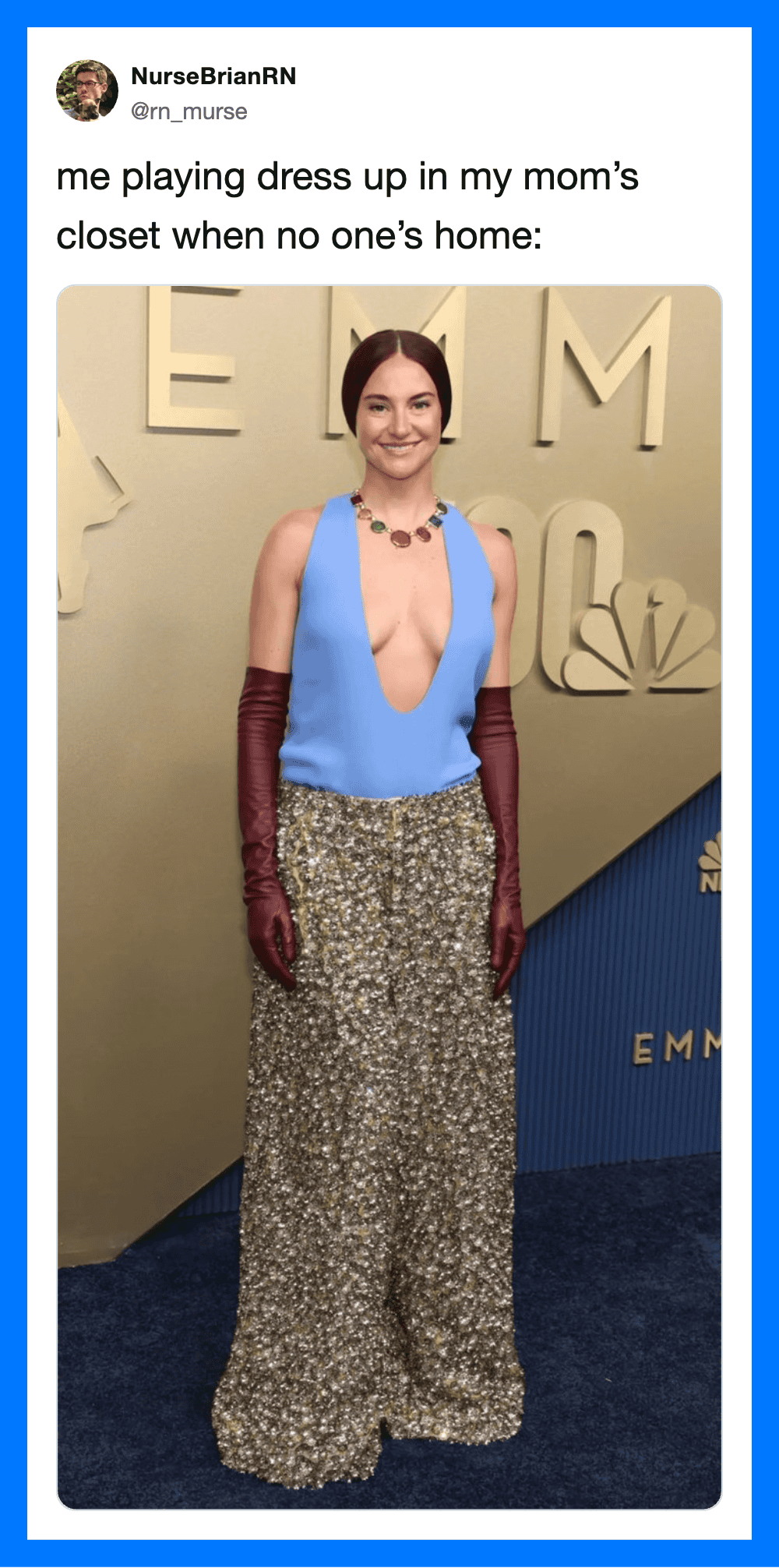 Woman in blue top and patterned pants with long gloves at an event.