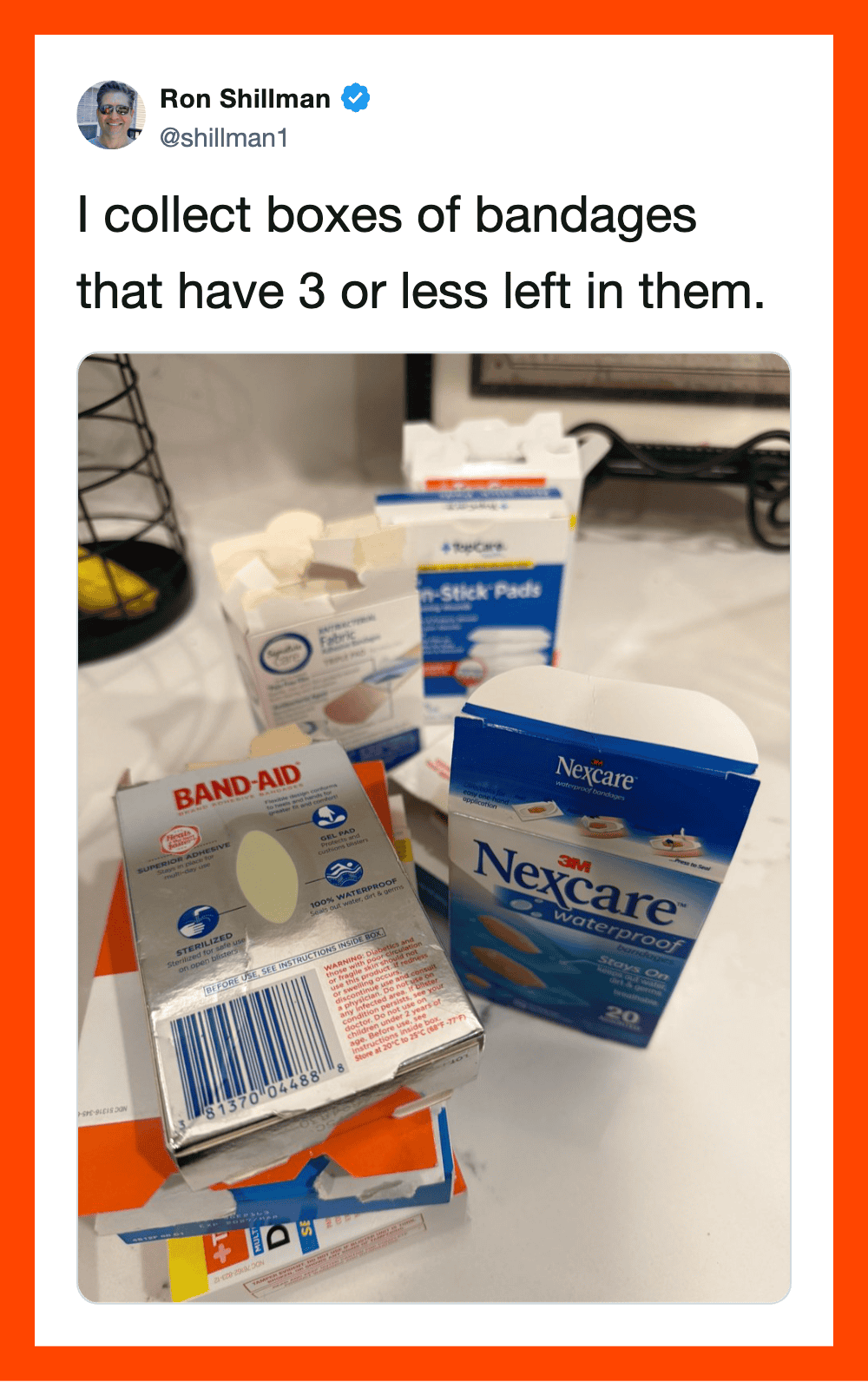 Collection of bandage boxes with three or fewer left, on a countertop.