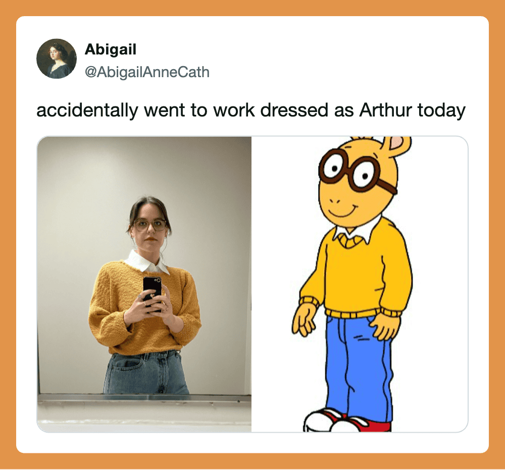 Photo of a woman in a yellow sweater and glasses taking a mirror selfie next to Arthur from Sesame.