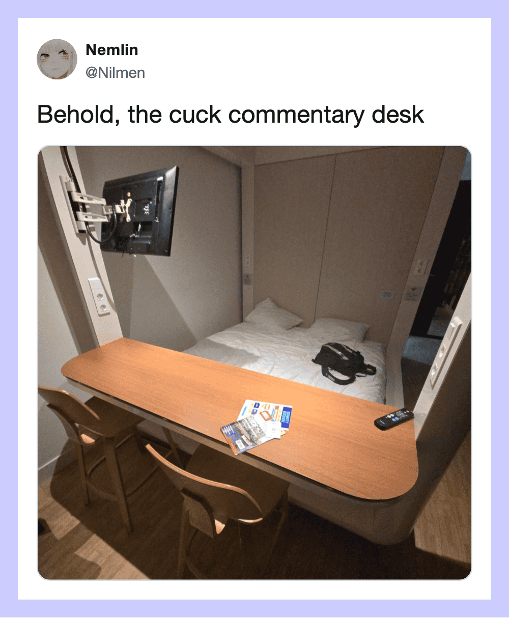 Behold, the cuck commentary desk with a bed, table, chairs, and a TV.