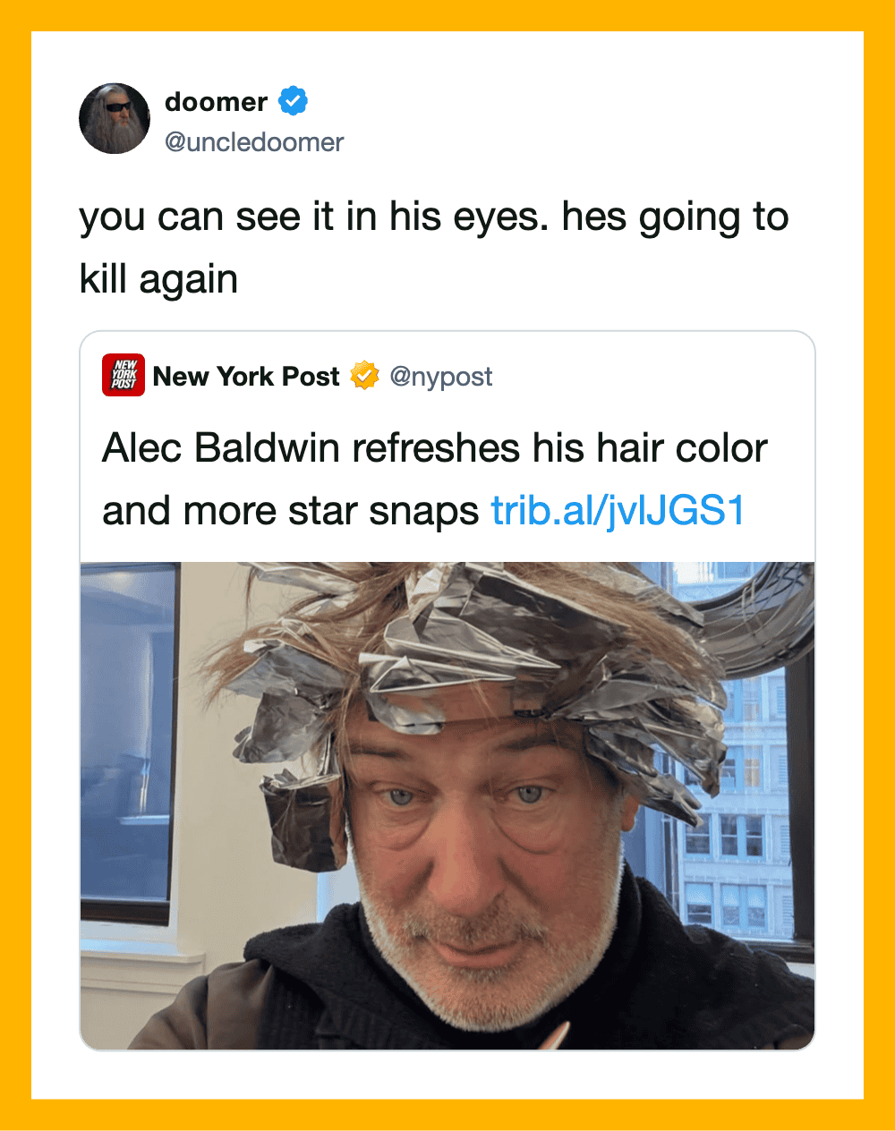 A man with hair covered in aluminum foil, looking at the camera.