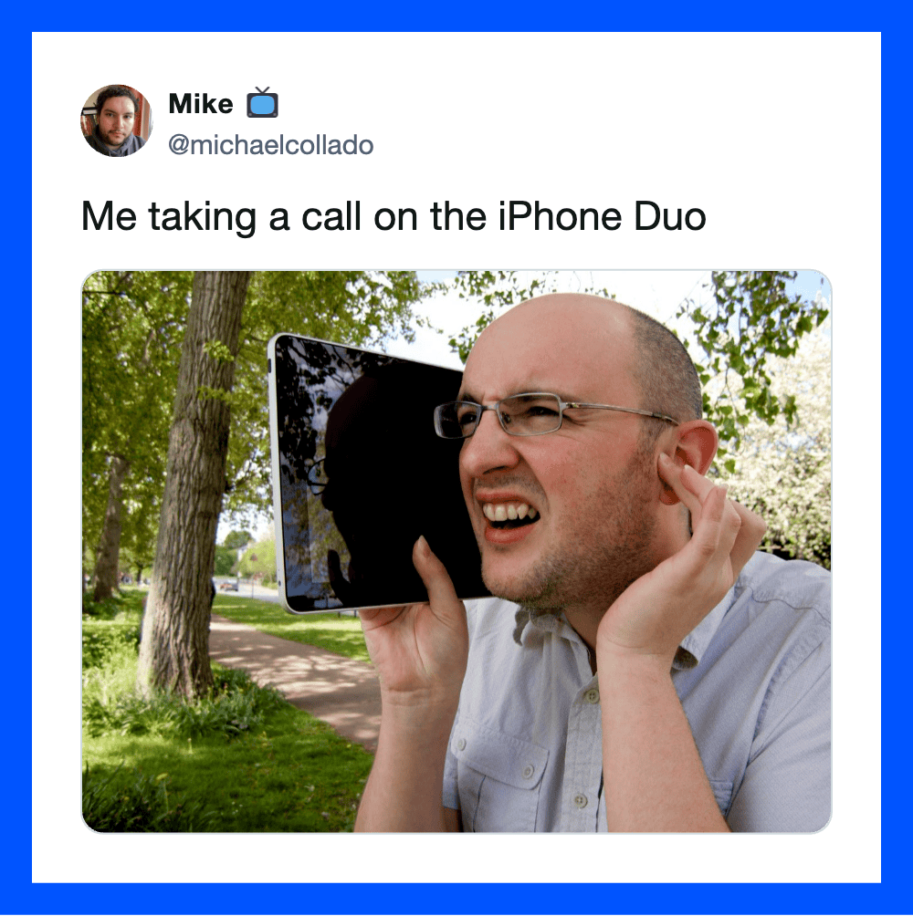 Man holding iPhone Duo to his ear, outdoors, with trees and a path in background.