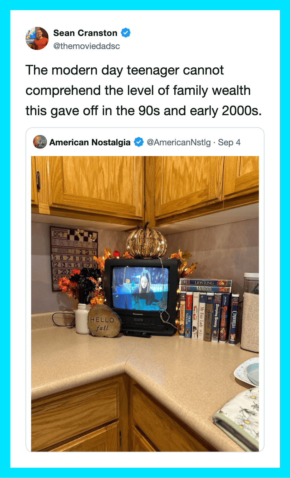 A small TV on a kitchen counter showing a video call, surrounded by books and decorative items.