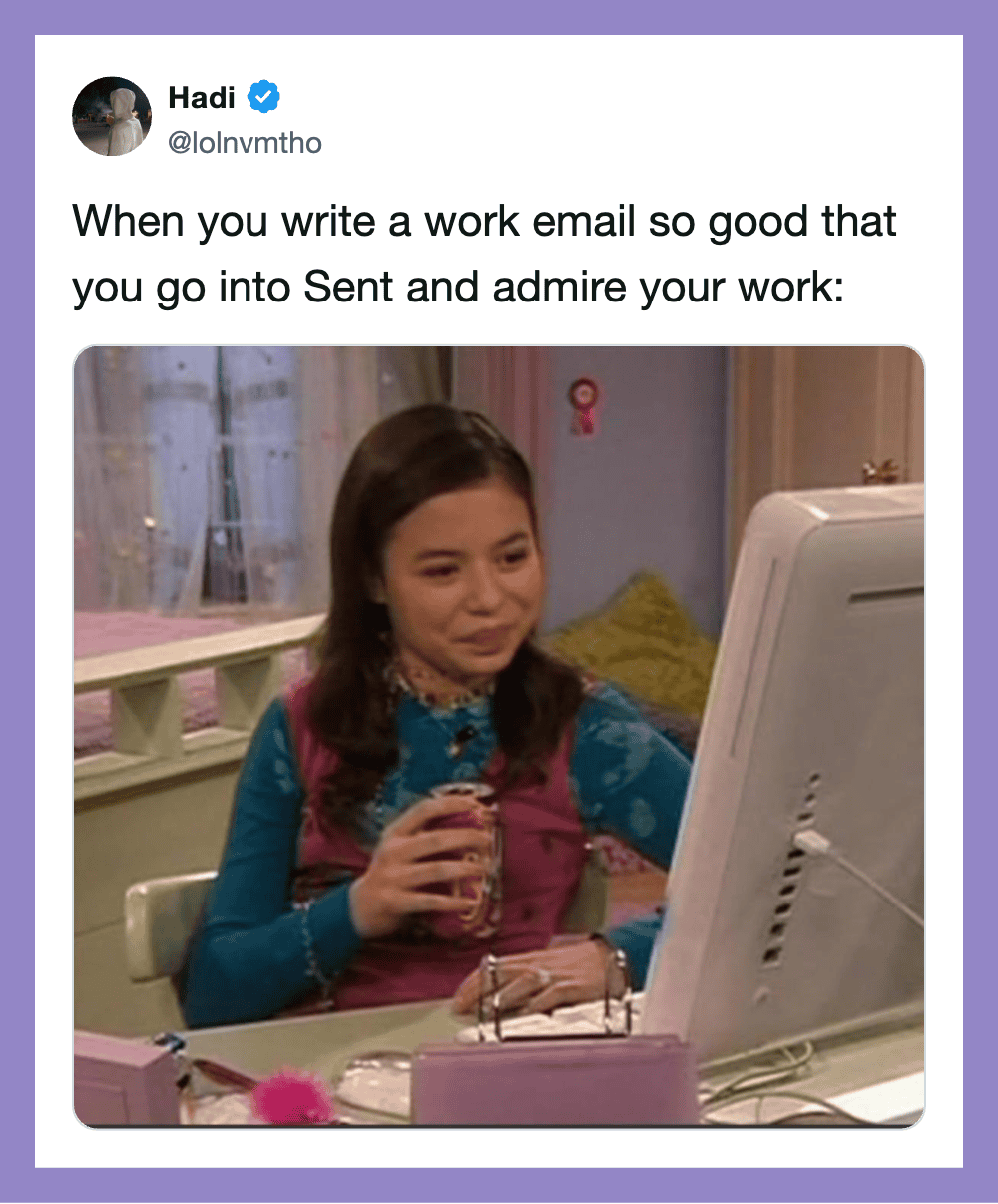 Young girl smiling at computer with a drink in her hand, working from home.