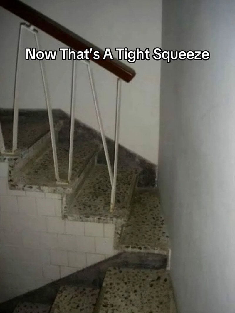 Staircase with a tight squeeze and a humorous caption.