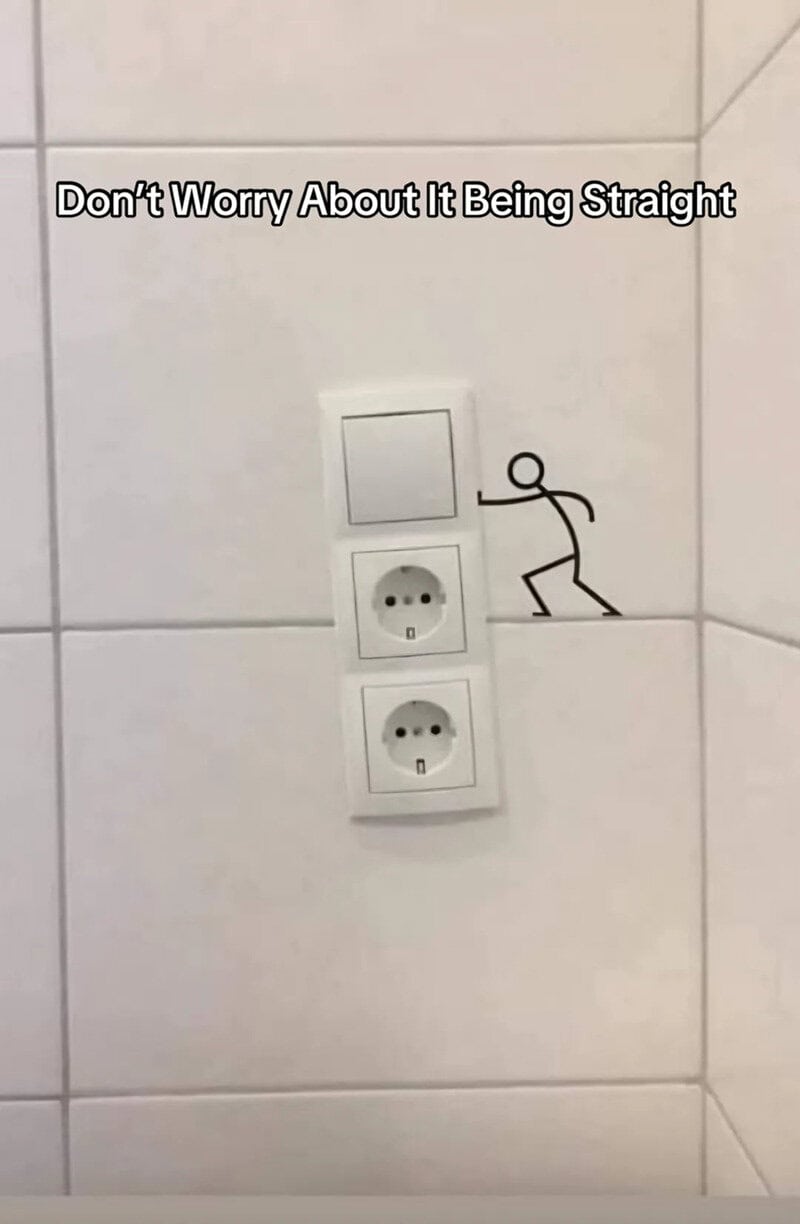 Don't worry about it being straight with a drawing of a person leaning on the wall.