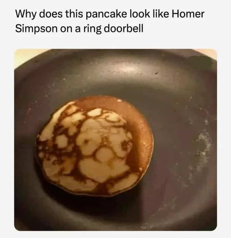 Pancake in a pan resembling Homer Simpson on a ring doorbell.