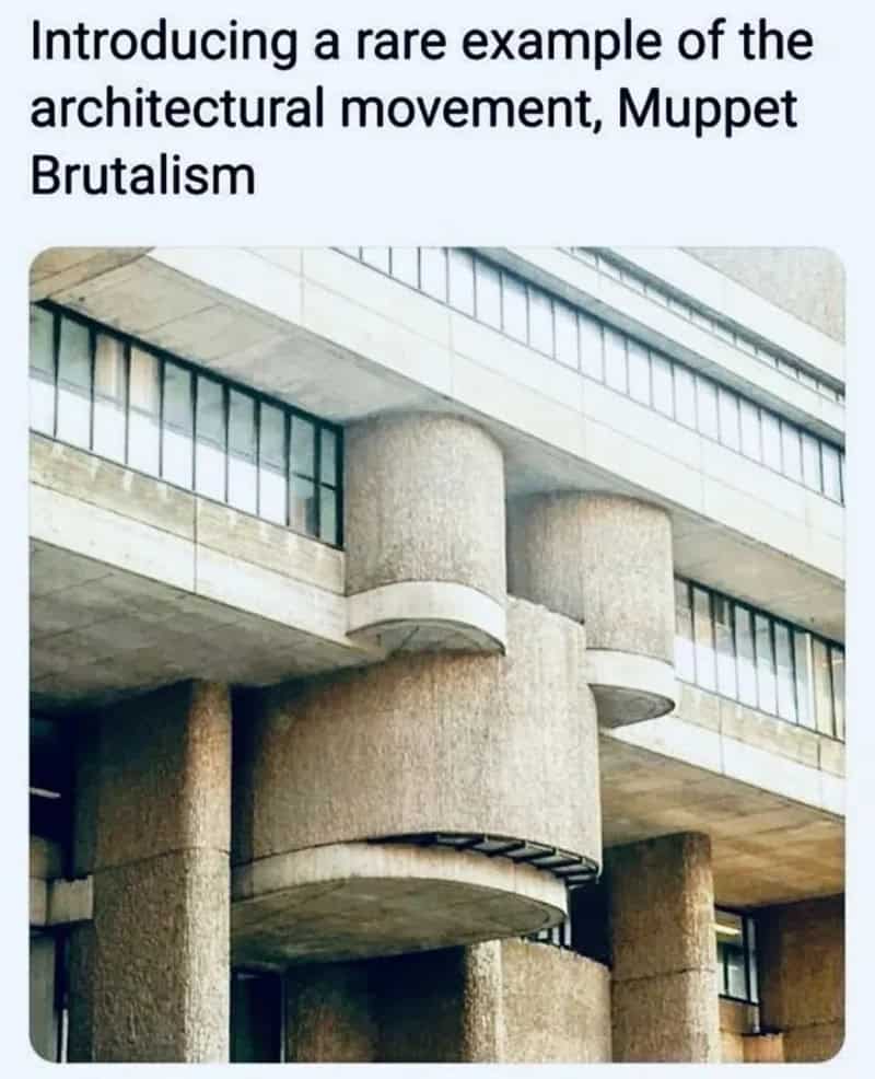 Architectural building with rounded concrete supports and overhanging sections.