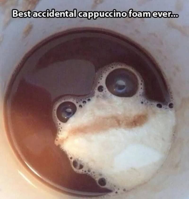 A cup of cappuccino with foam resembling a face, with the caption 'Best accidental cappuccino foam e.